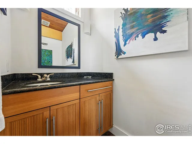 a bathroom with a shower and a sink