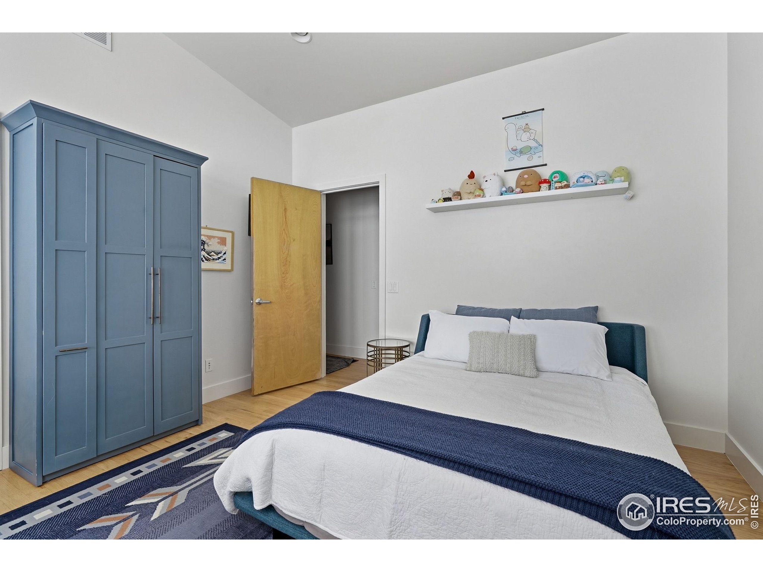 1127 Valley Lane Boulder, CO 80302 - Photo 29 of 48 a bedroom with a bed and a cabinets