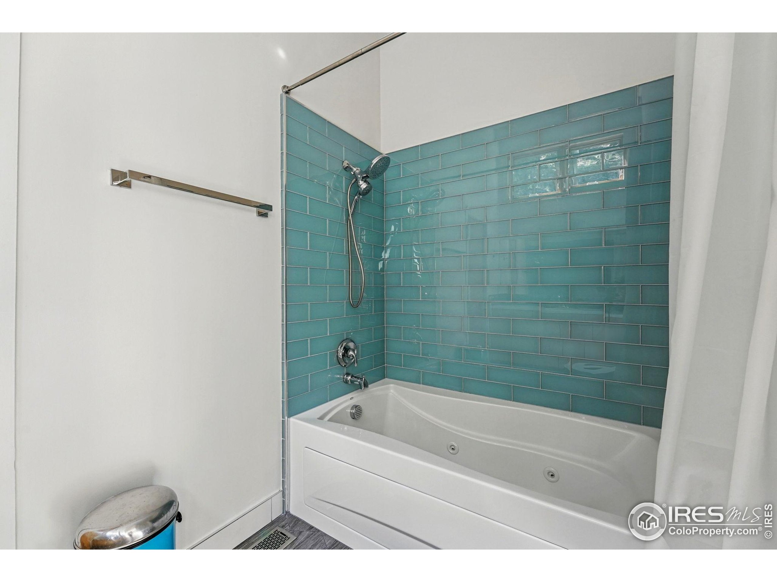 1127 Valley Lane Boulder, CO 80302 - Photo 31 of 48 a bathroom with a bathtub and shower