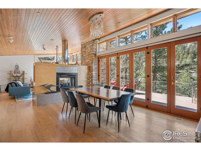 a kitchen with stainless steel appliances kitchen island granite countertop a sink a counter space and cabinets