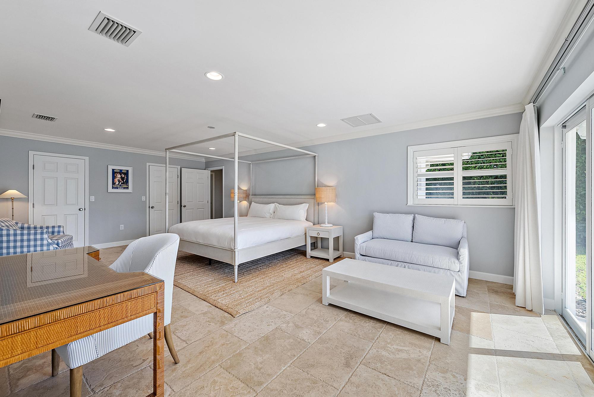 1051 Gulfstream Way Singer Island, FL 33404 - Photo 13 of 49 a bedroom with furniture and a couch