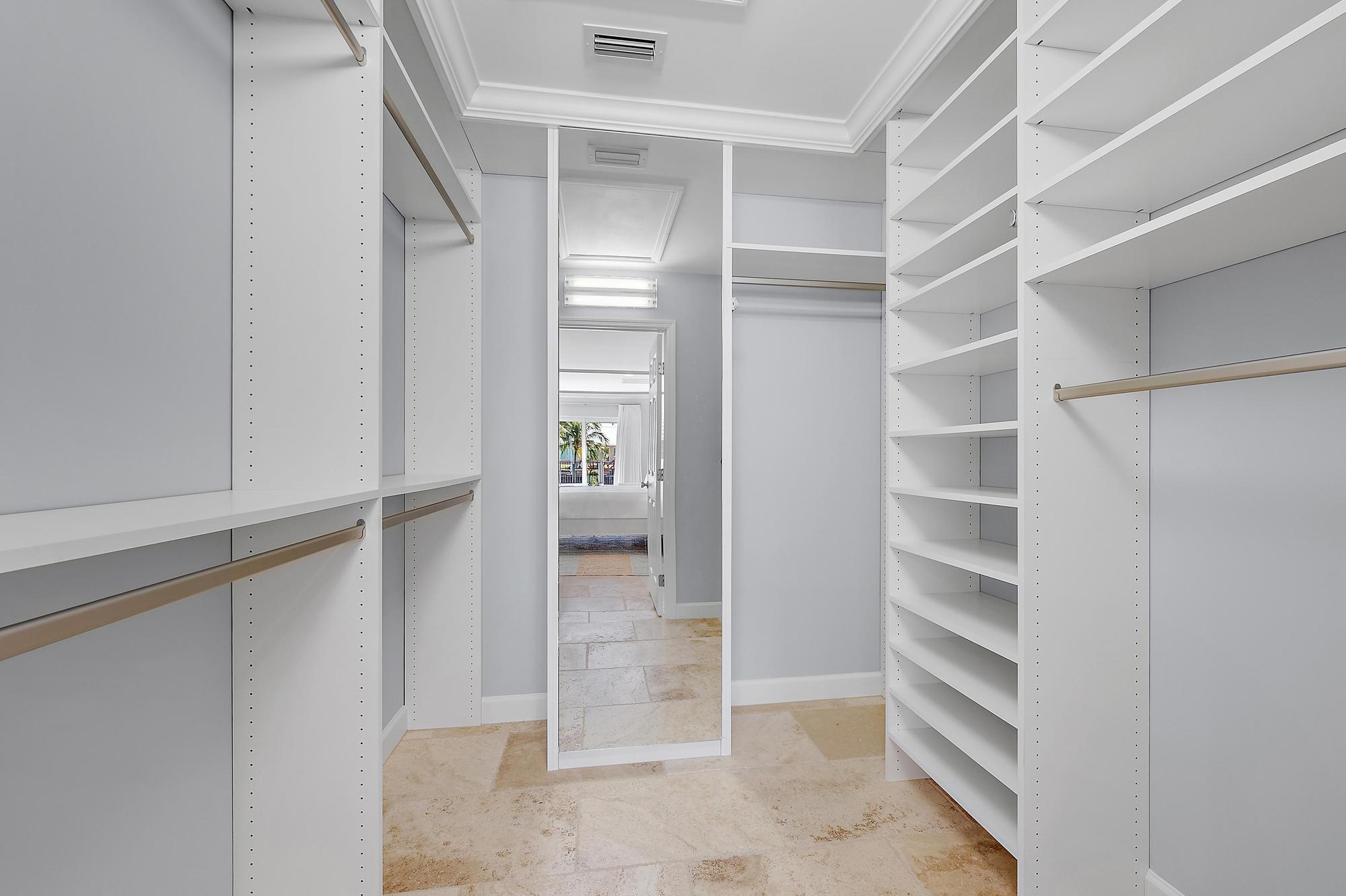 1051 Gulfstream Way Singer Island, FL 33404 - Photo 16 of 49 a view of an empty walk in closet