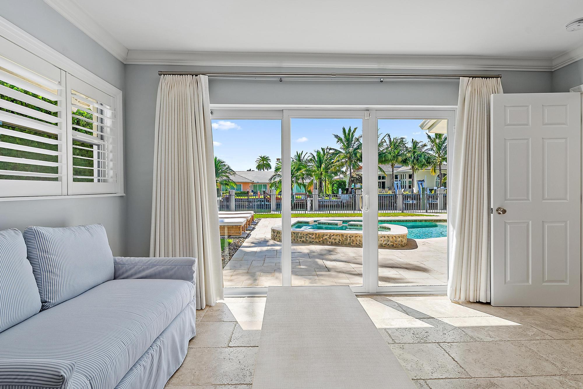 1051 Gulfstream Way Singer Island, FL 33404 - Photo 18 of 49 a living room with furniture and a large window