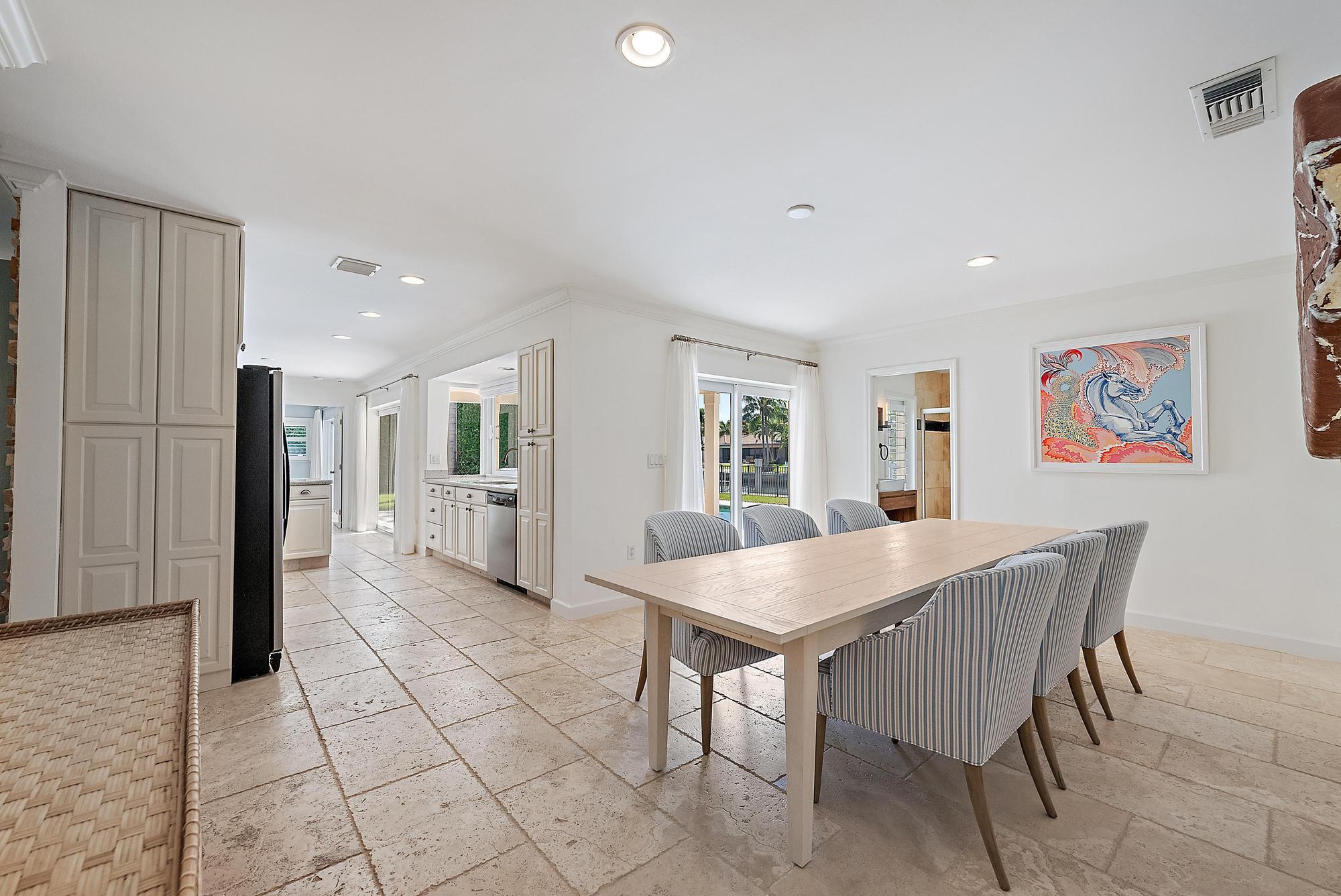 1051 Gulfstream Way Singer Island, FL 33404 - Photo 20 of 49 a view of a dining room with furniture