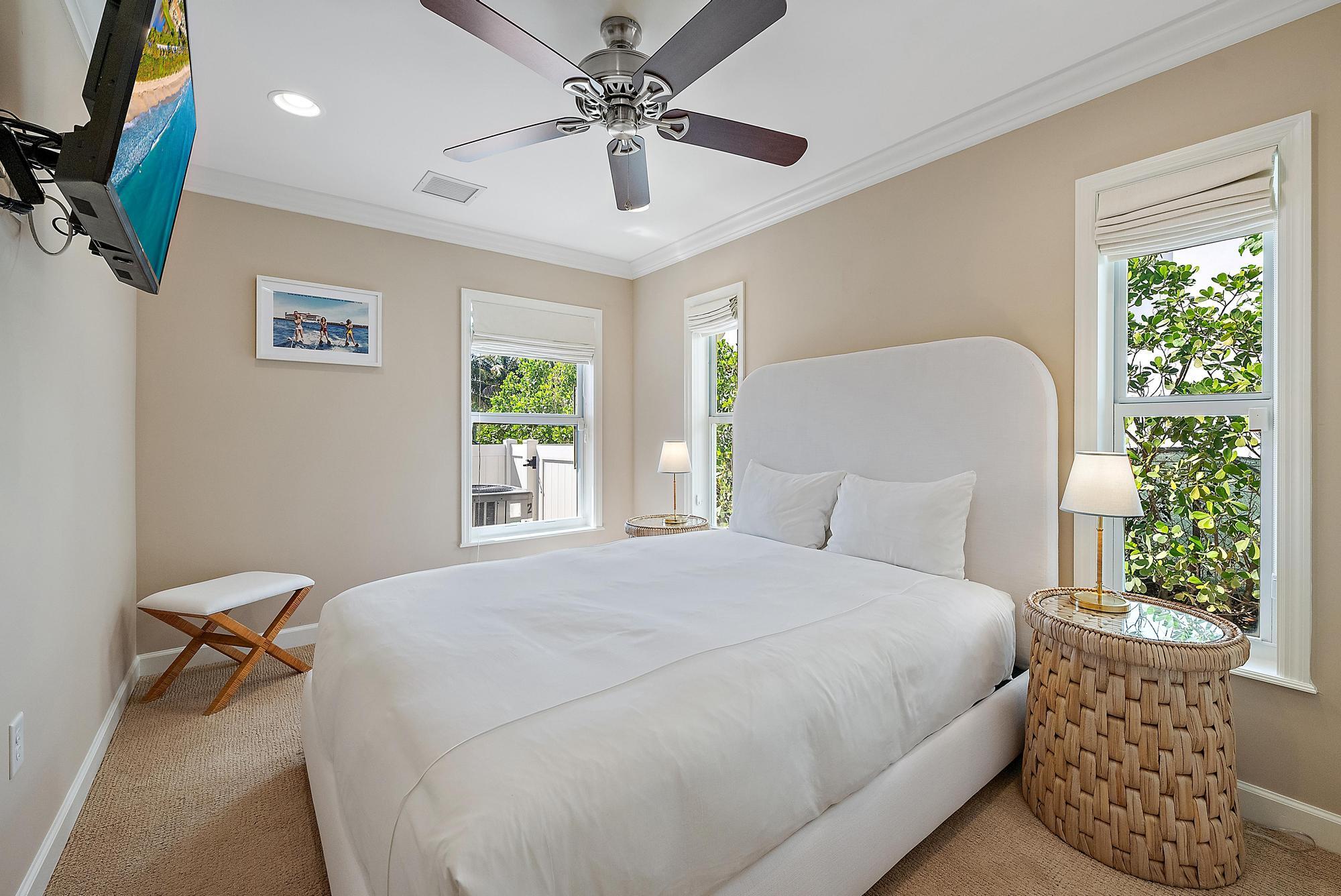 1051 Gulfstream Way Singer Island, FL 33404 - Photo 25 of 49 a bedroom with a bed ceiling fan and a window
