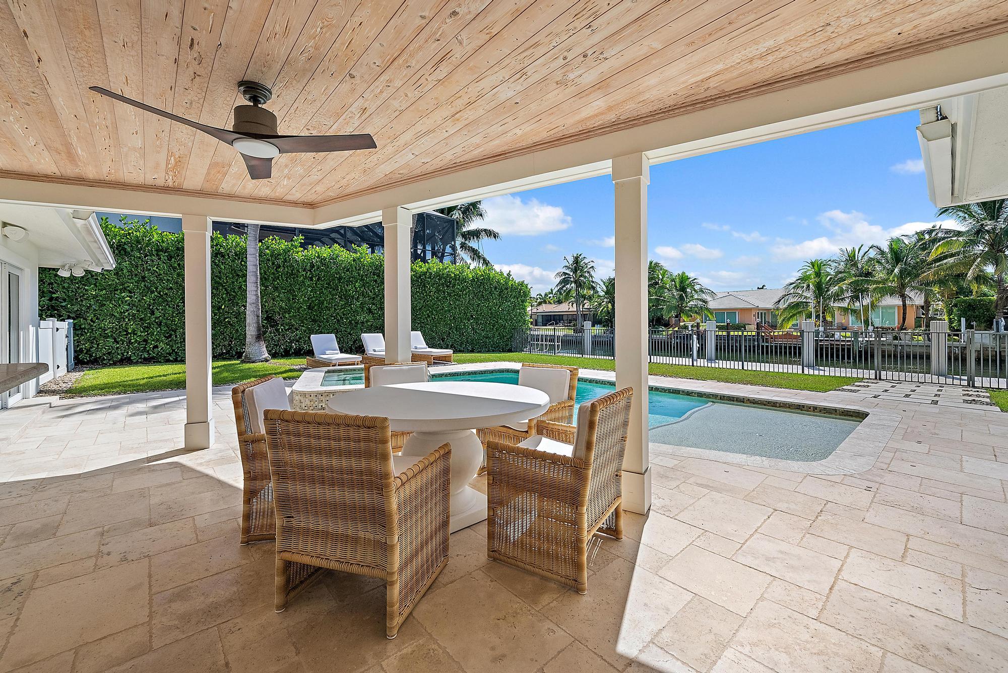 1051 Gulfstream Way Singer Island, FL 33404 - Photo 30 of 49 a view of a swimming pool with a patio