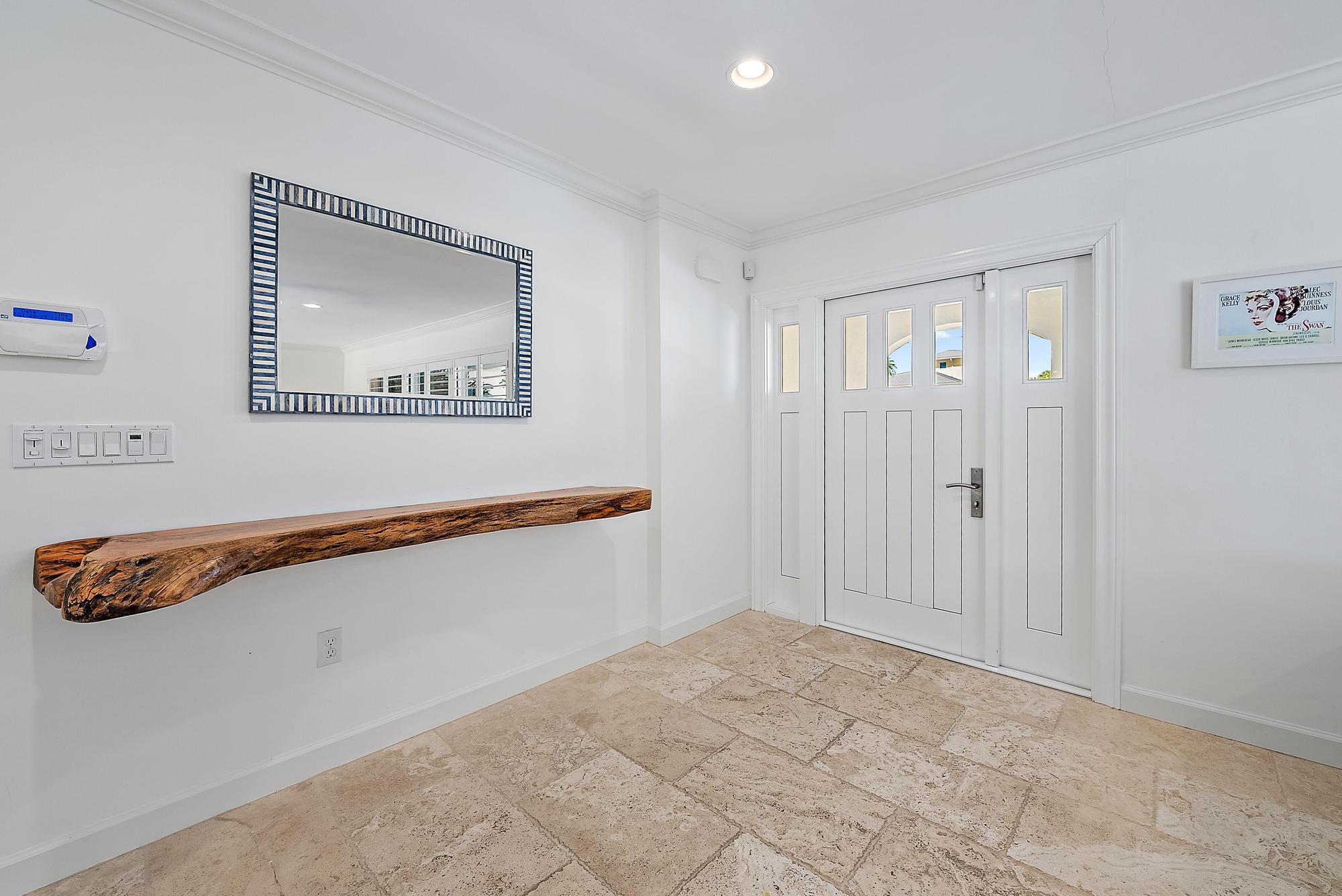 1051 Gulfstream Way Singer Island, FL 33404 - Photo 4 of 49 a view of an empty room with painting on the wall