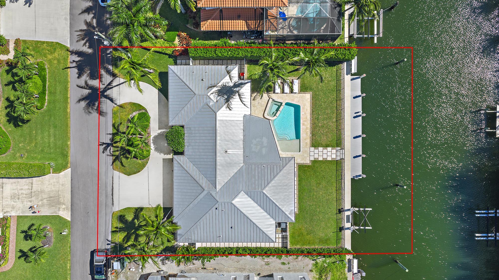 1051 Gulfstream Way Singer Island, FL 33404 - Photo 42 of 49 an aerial view of a house with a yard