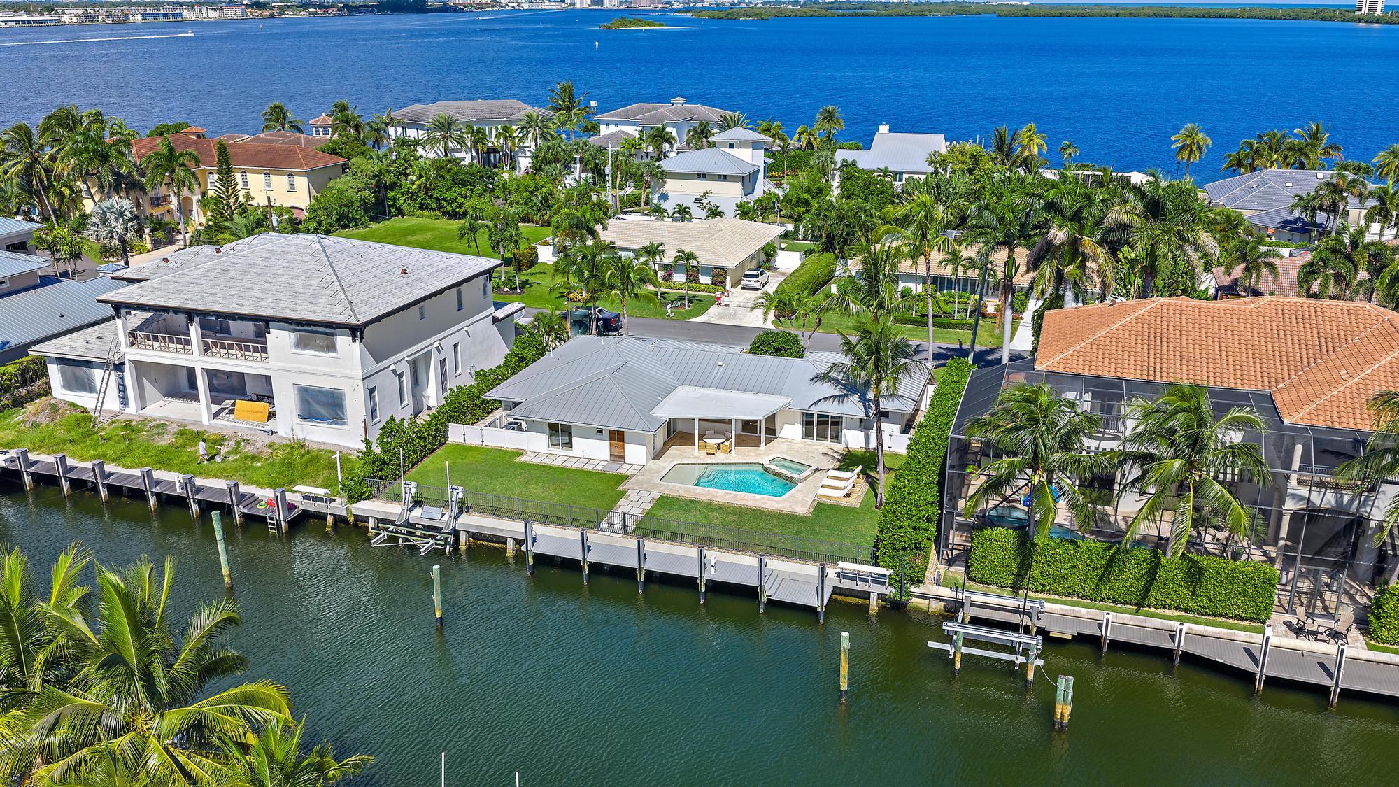 1051 Gulfstream Way Singer Island, FL 33404 - Photo 44 of 49 an aerial view of a house with swimming pool garden view and a lake view