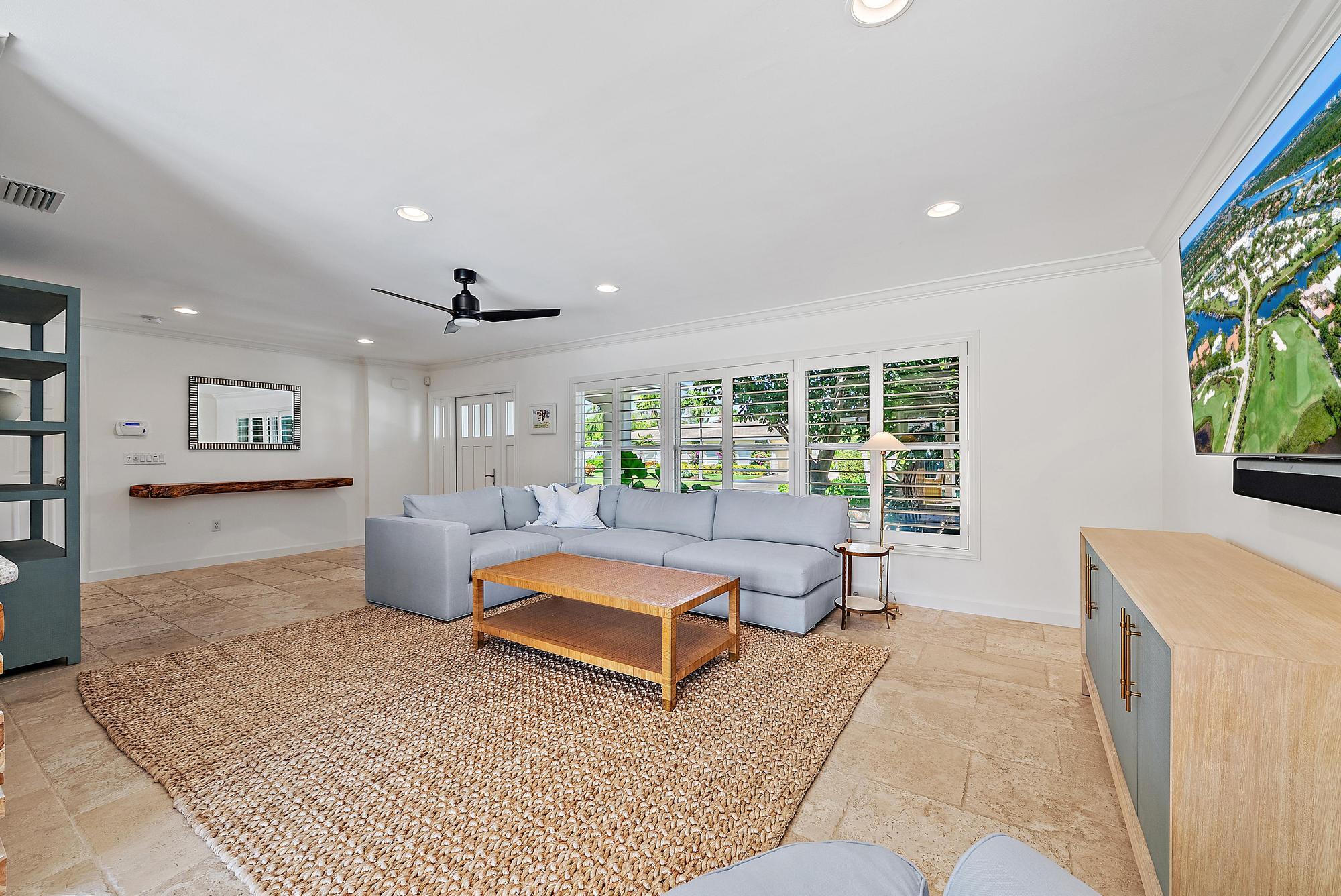 1051 Gulfstream Way Singer Island, FL 33404 - Photo 6 of 49 a living room with furniture and a large window