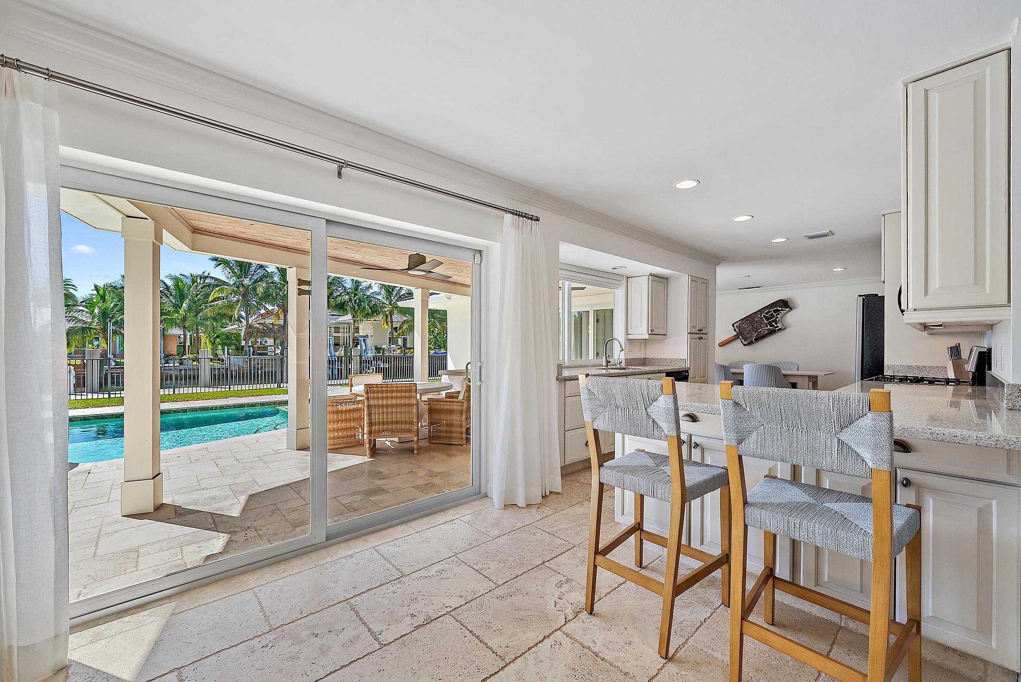 1051 Gulfstream Way Singer Island, FL 33404 - Photo 8 of 49 a living room with furniture and large windows
