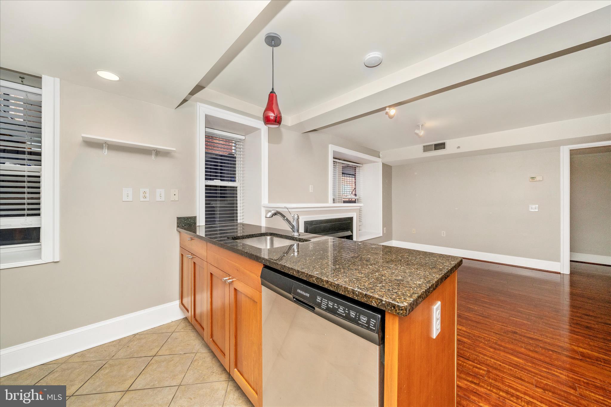 1750 16th Street Northwest, Unit 4 Washington, DC 20009 - Photo 16 of 53 a kitchen with stainless steel appliances granite countertop a sink and a counter space