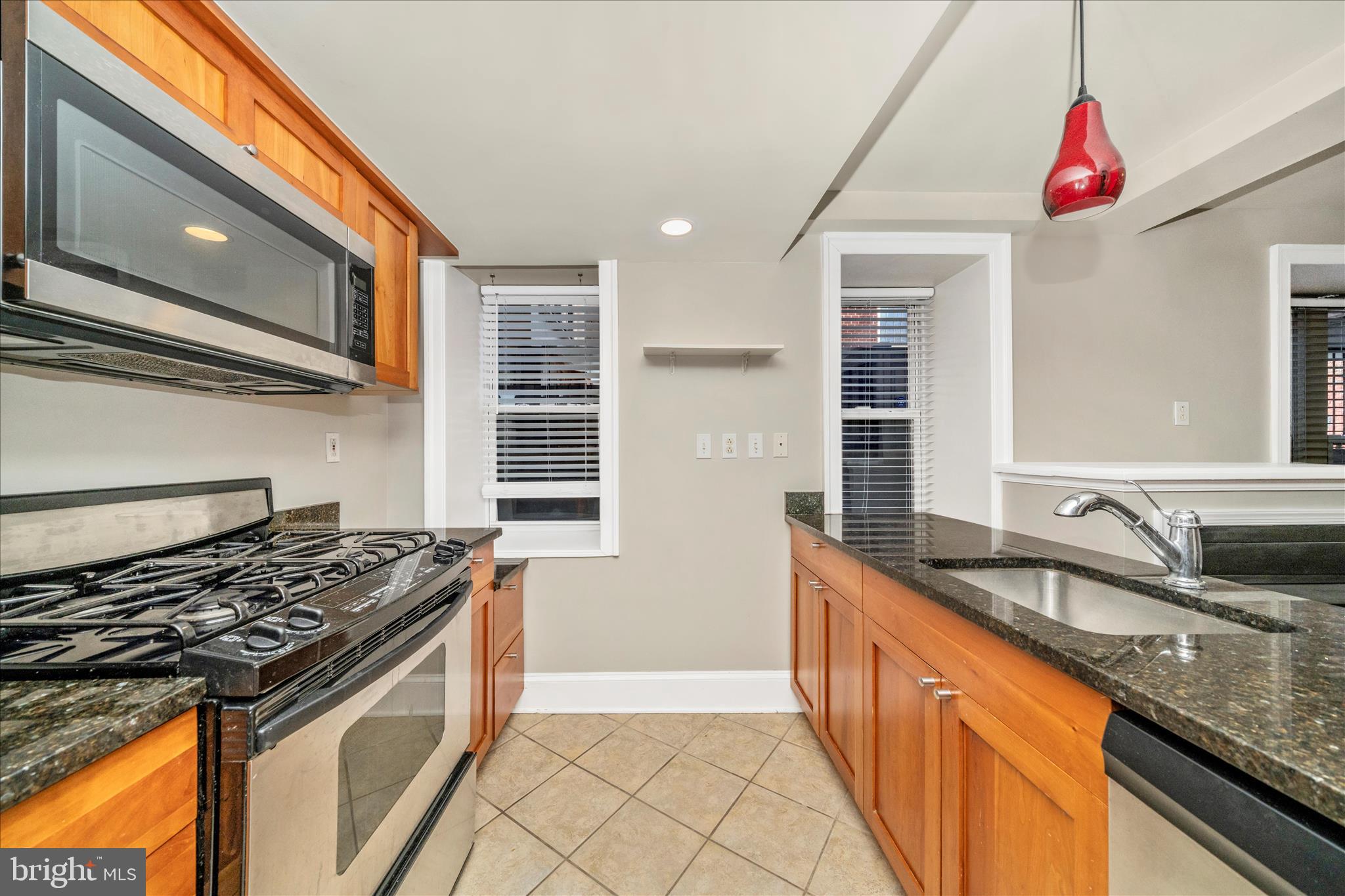 1750 16th Street Northwest, Unit 4 Washington, DC 20009 - Photo 17 of 53 a kitchen that has a sink and a stove
