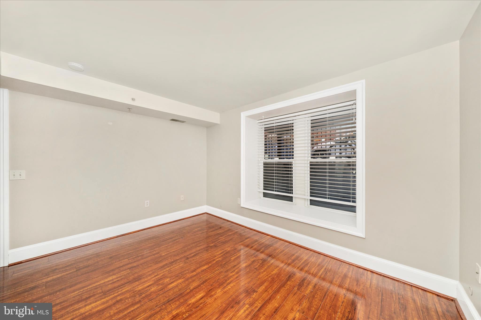 1750 16th Street Northwest, Unit 4 Washington, DC 20009 - Photo 21 of 53 a view of a room with wooden floor and windows