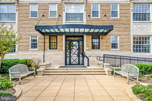 a front view of a house with a outdoor seating