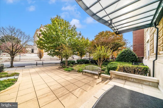 a view of swimming pool with outdoor seating and plants