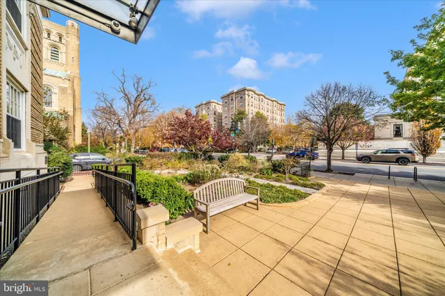 a very nice looking room with a large window and white walls