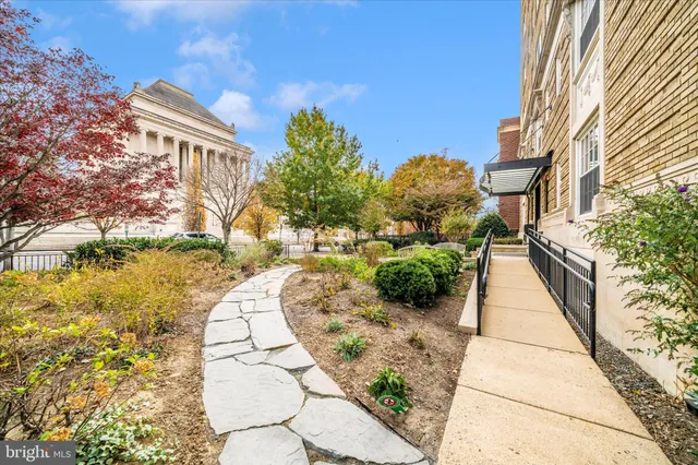 view of an entryway with wooden floor and a living room