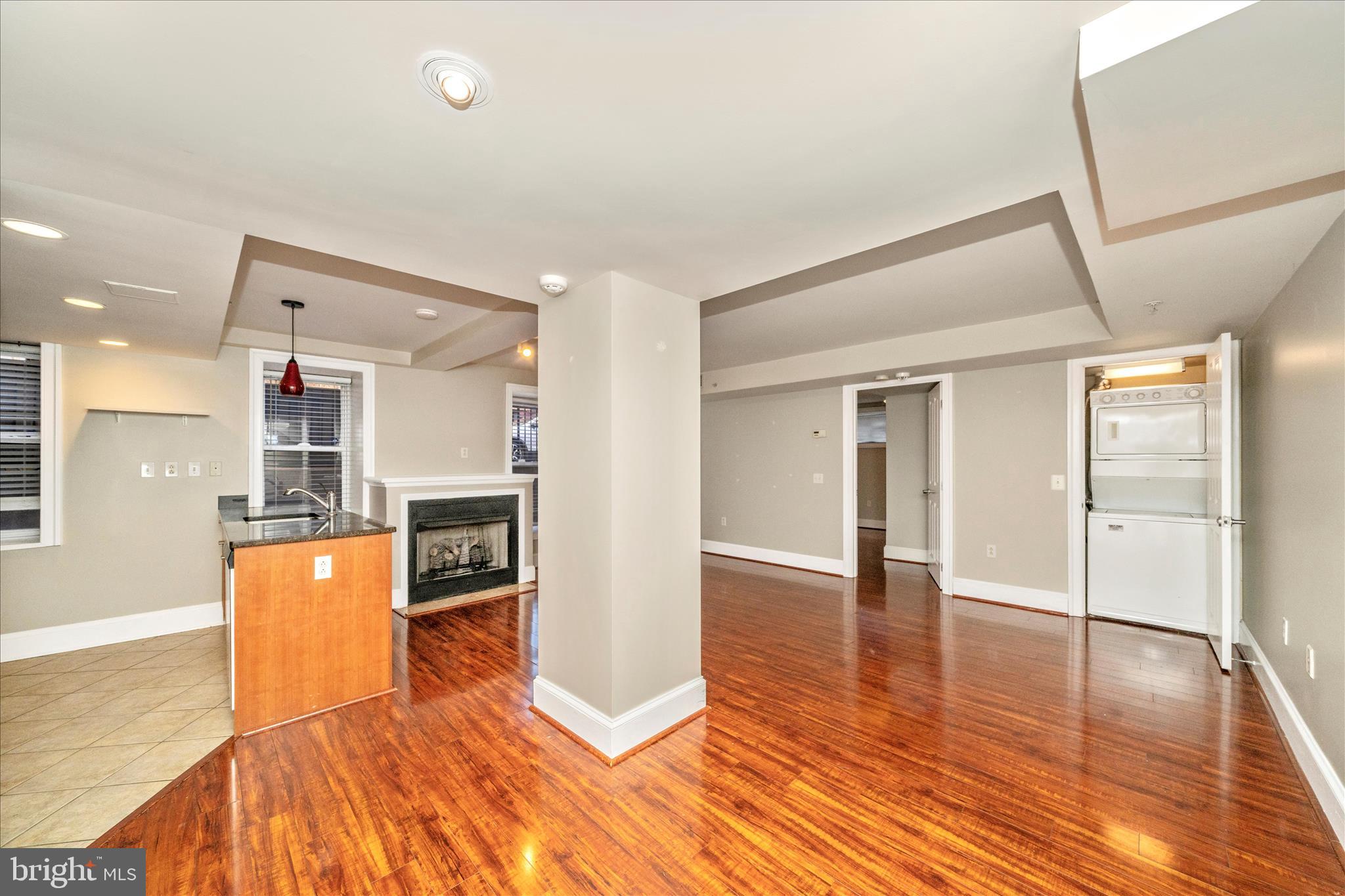1750 16th Street Northwest, Unit 4 Washington, DC 20009 - Photo 4 of 53 a view of a kitchen with a refrigerator and a stove top oven
