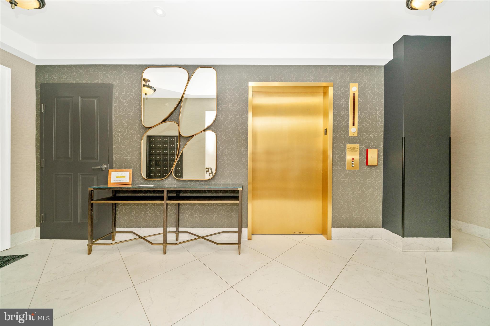 1750 16th Street Northwest, Unit 4 Washington, DC 20009 - Photo 48 of 53 a view of a hallway with wooden floor table and windows