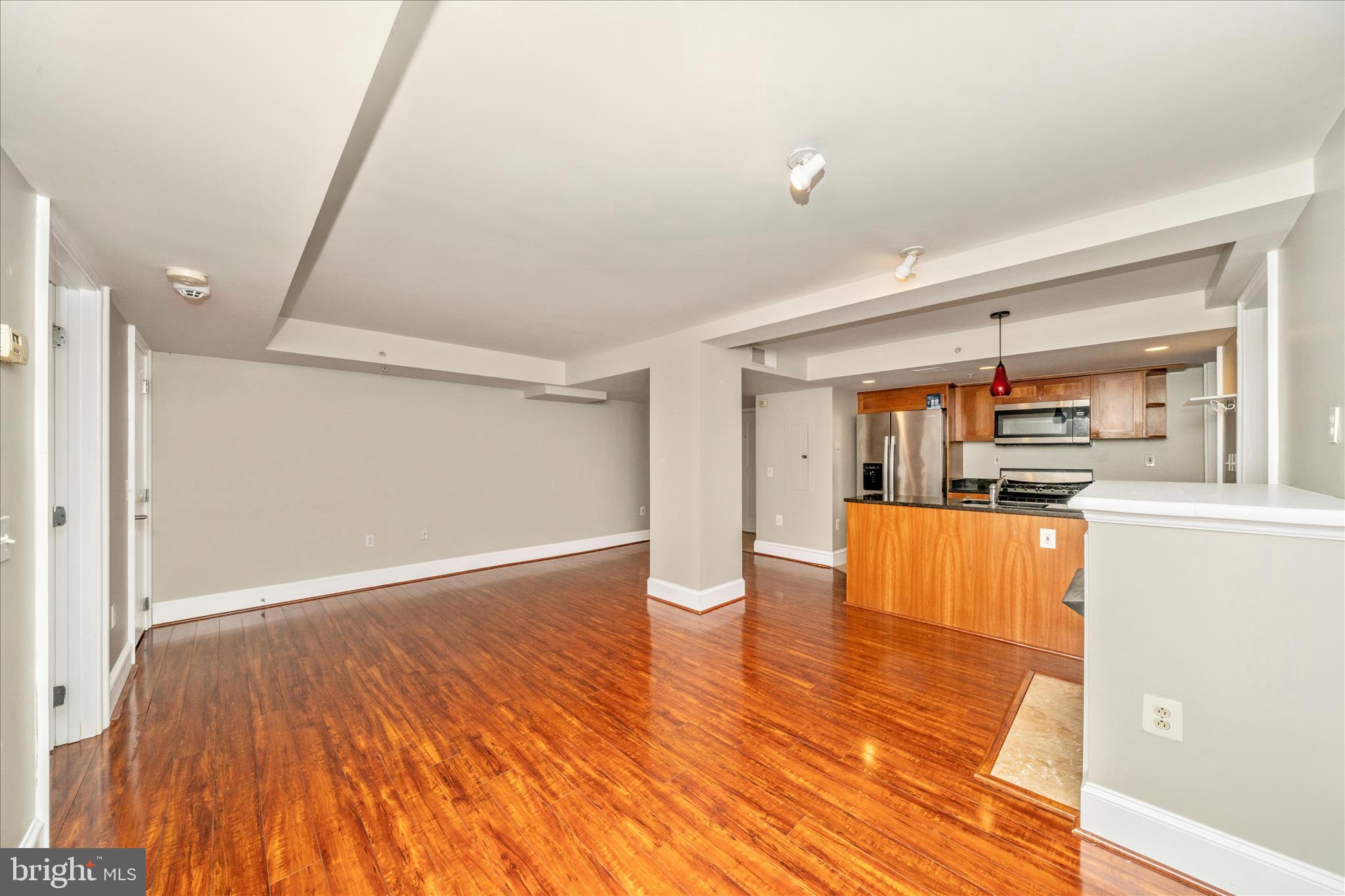 1750 16th Street Northwest, Unit 4 Washington, DC 20009 - Photo 6 of 53 wooden floor in an empty room with a window
