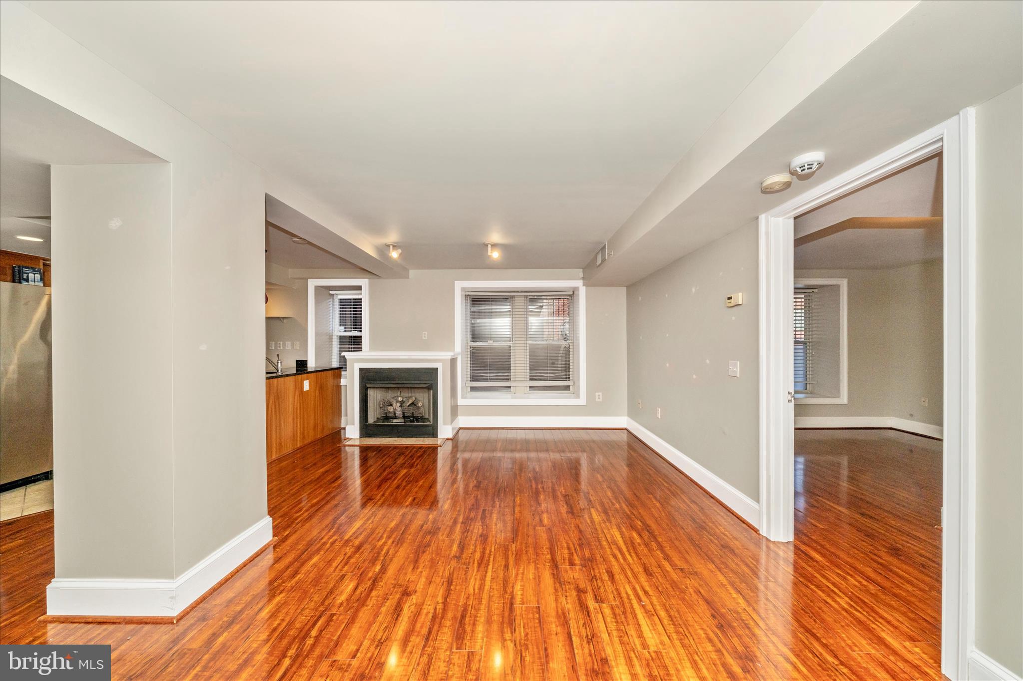 1750 16th Street Northwest, Unit 4 Washington, DC 20009 - Photo 8 of 53 wooden floor in an empty room with a window