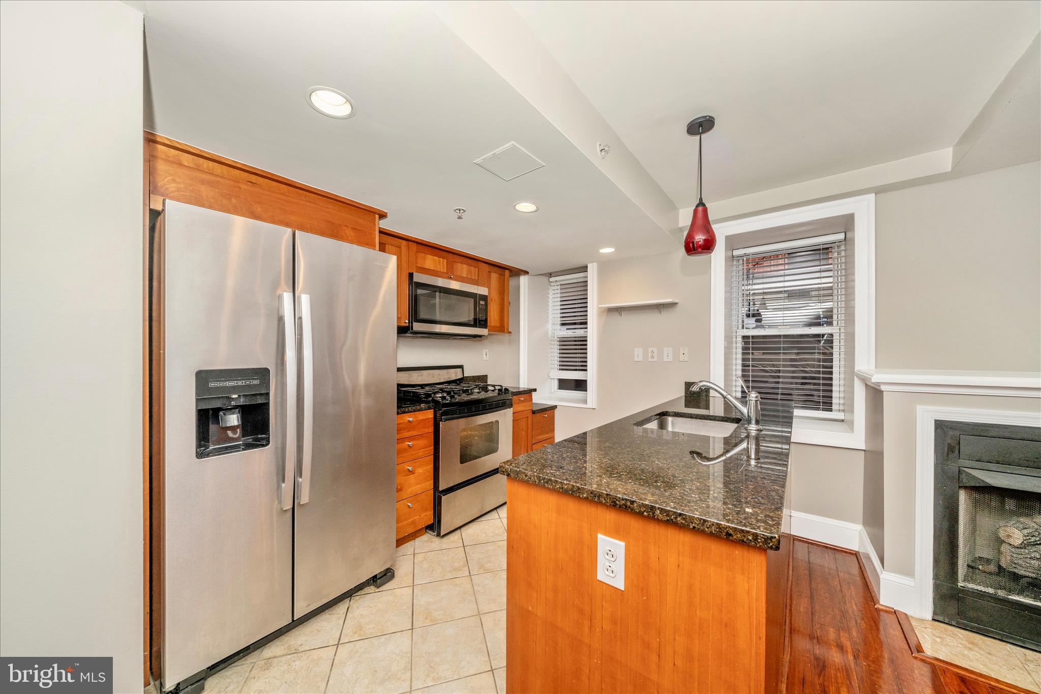 1750 16th Street Northwest, Unit 4 Washington, DC 20009 - Photo 10 of 53 a kitchen with stainless steel appliances granite countertop a refrigerator a oven and a sink with granite countertops