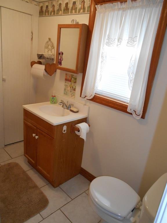 587 Amity Ridge Road Amity, PA 15311 - Photo 13 of 25 Main floor full bath with ceramic tile floor and storage.