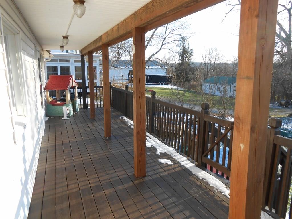 587 Amity Ridge Road Amity, PA 15311 - Photo 19 of 25 Full length back porch with view of sunsets and countryside.