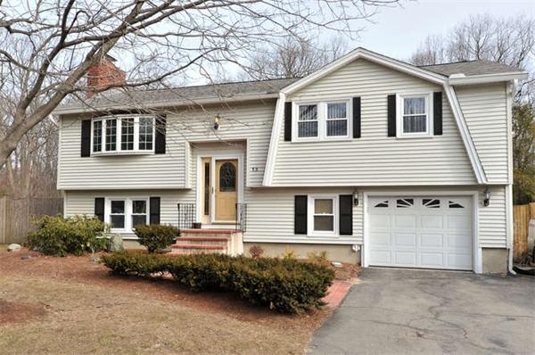 13 Town Line Road Burlington, MA 01803 - Photo 1 of 22 a front view of a house with a garden