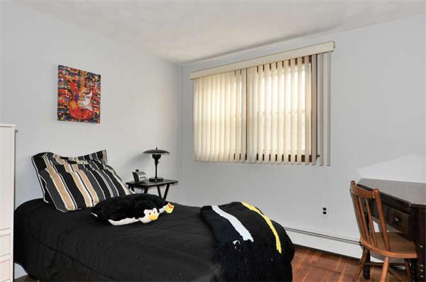 13 Town Line Road Burlington, MA 01803 - Photo 12 of 22 a bed sitting in a bedroom next to a window