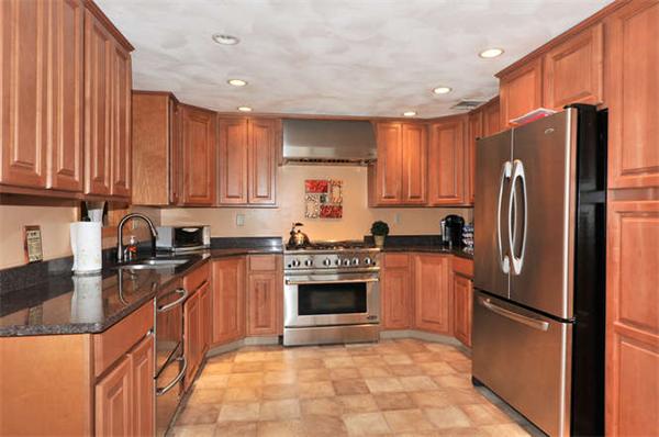 13 Town Line Road Burlington, MA 01803 - Photo 2 of 22 a kitchen with stainless steel appliances granite countertop a refrigerator stove top oven and sink