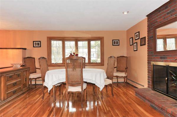 13 Town Line Road Burlington, MA 01803 - Photo 9 of 22 a view of a dining room with furniture a chandelier and wooden floor