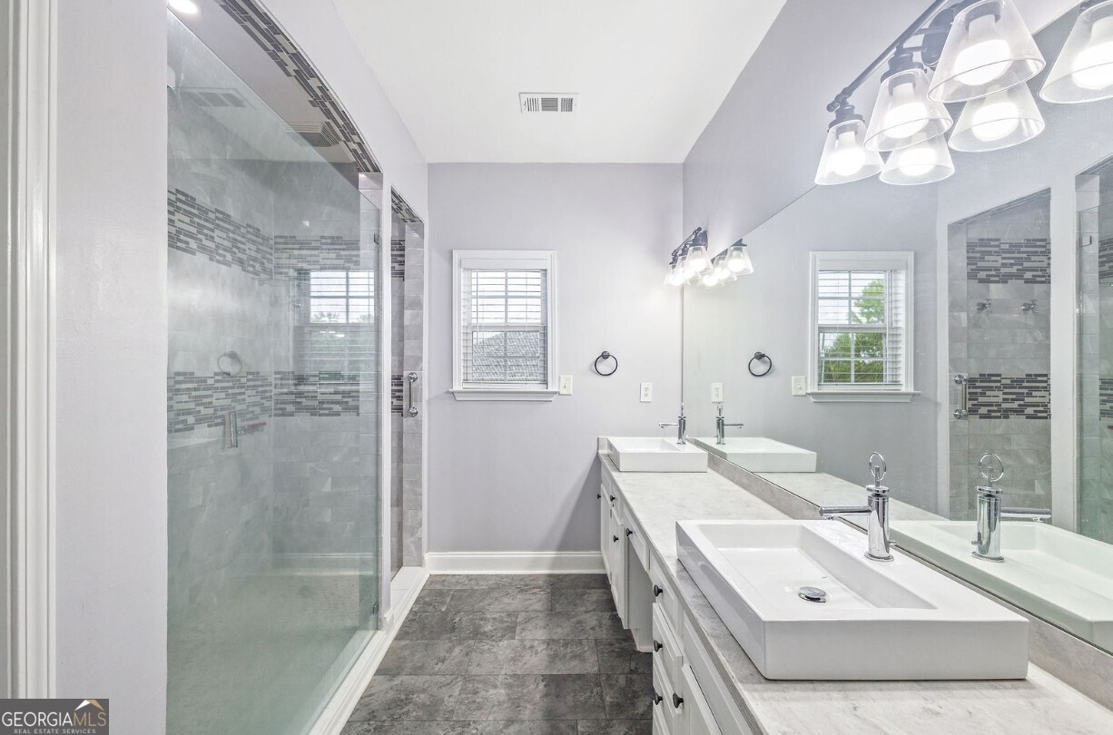 82 Newton Road LaGrange, GA 30240 - Photo 23 of 45 a bathroom with a double vanity sink mirror and shower