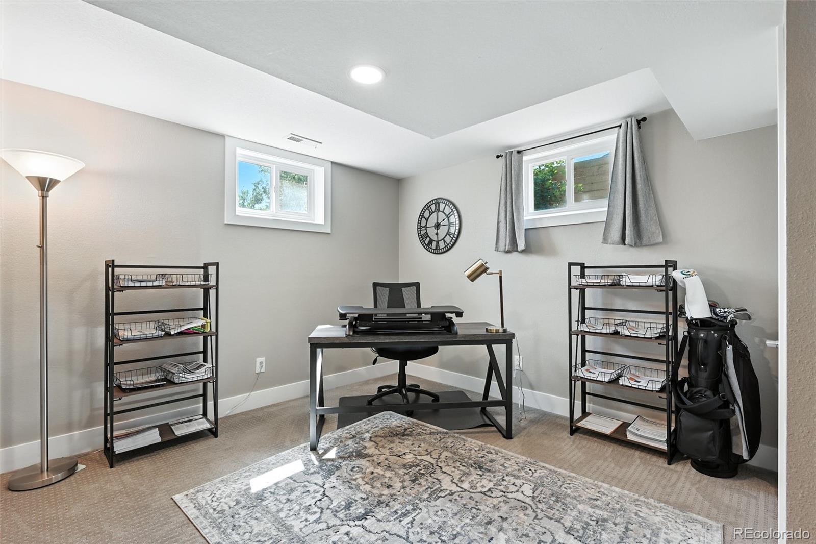 2714 South Raleigh Street Denver, CO 80236 - Photo 24 of 34 a view of a workspace with furniture