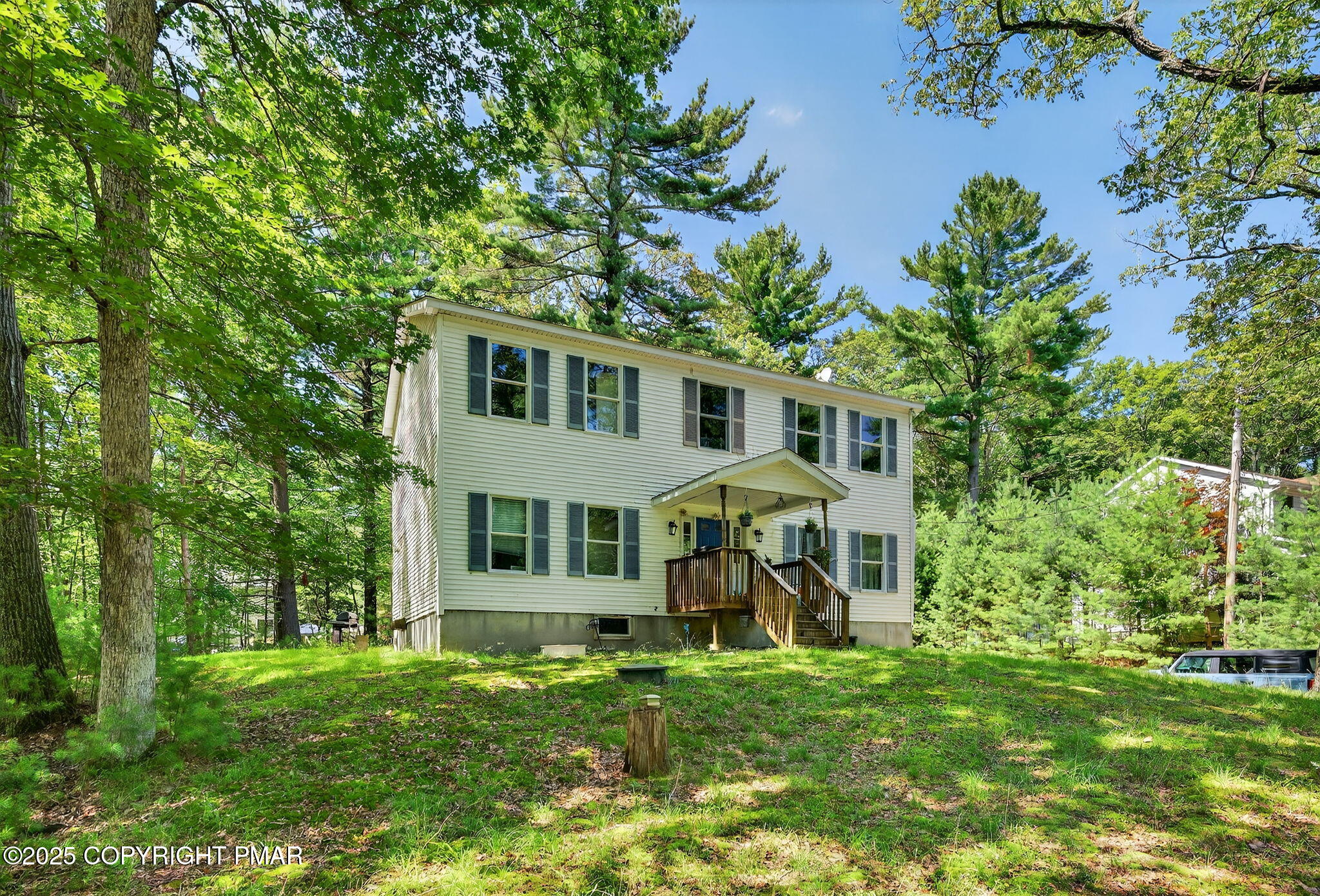 375 Marcel Drive Dingmans Ferry, PA 18328 - Photo 14 of 25 a view of a house with a yard and sitting area
