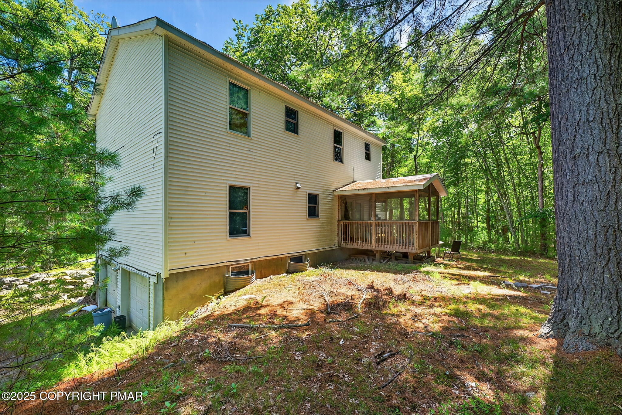 375 Marcel Drive Dingmans Ferry, PA 18328 - Photo 16 of 25 a view of house with yard and trees in the background