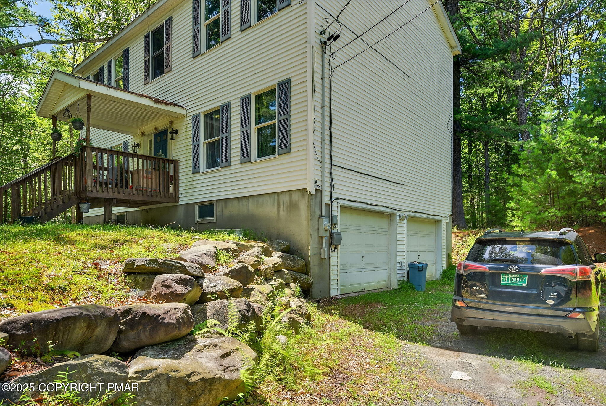 375 Marcel Drive Dingmans Ferry, PA 18328 - Photo 17 of 25 a front view of a house with a garden