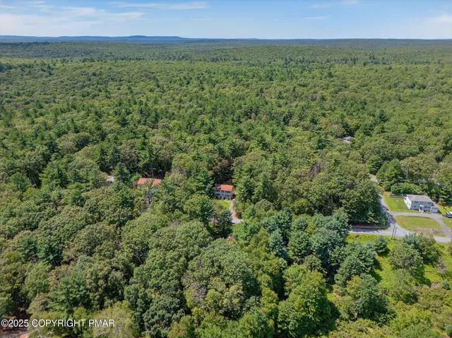 a view of a field with an outdoor space