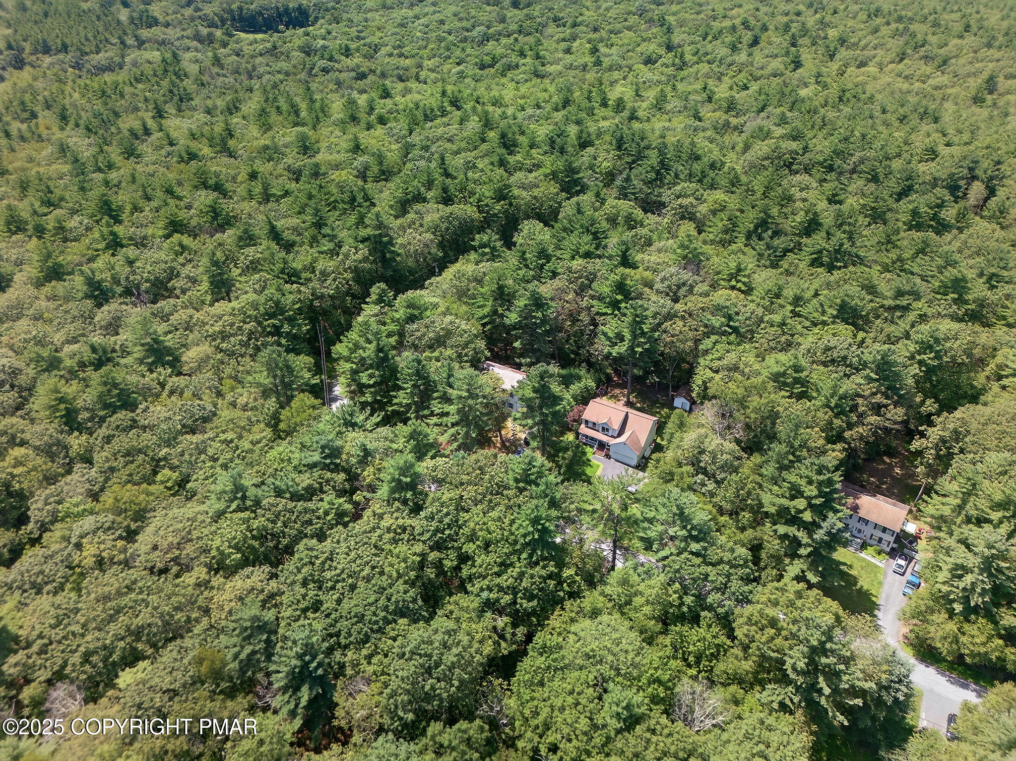 375 Marcel Drive Dingmans Ferry, PA 18328 - Photo 2 of 25 a view of a house with a tree