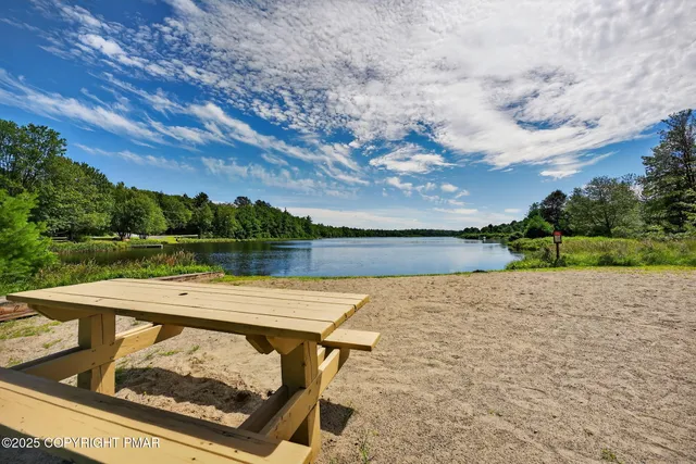 a view of a pool with a yard