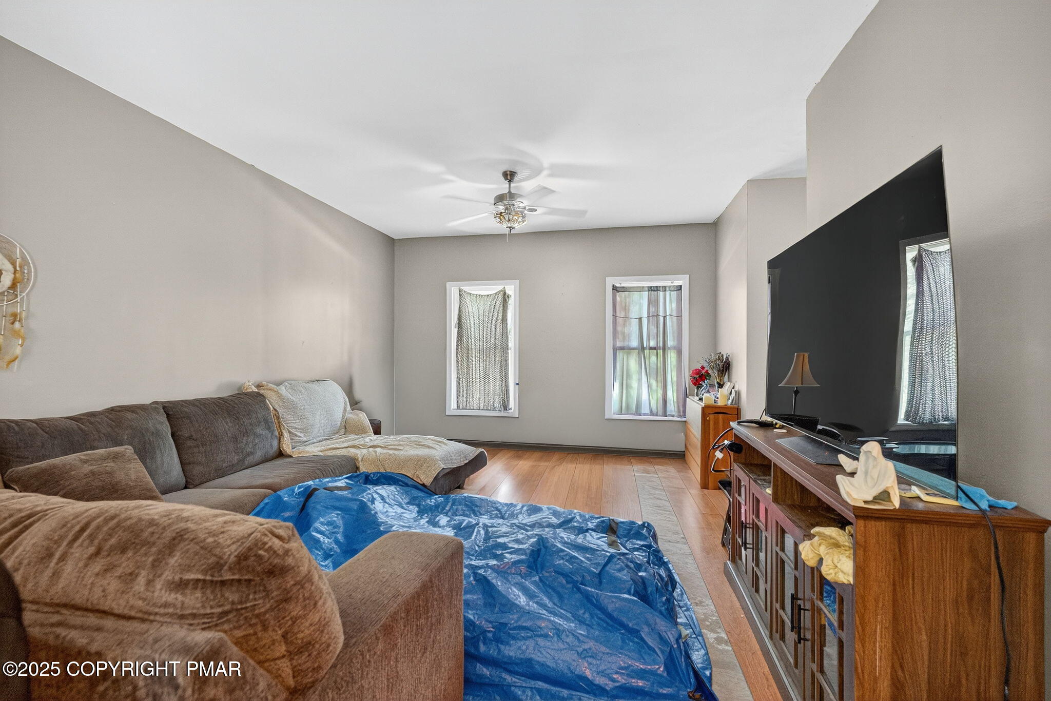 375 Marcel Drive Dingmans Ferry, PA 18328 - Photo 4 of 25 a living room with furniture and a flat screen tv