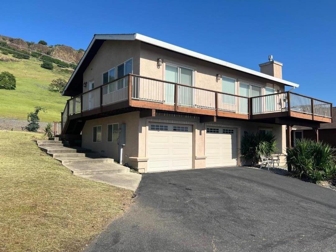 629 Poker Flat Road Copperopolis, CA 95228 - Photo 1 of 18 a view of a house with a street