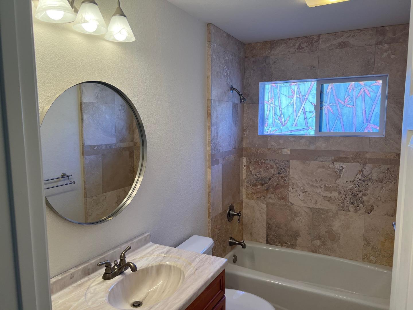 629 Poker Flat Road Copperopolis, CA 95228 - Photo 14 of 18 a bathroom with a sink a mirror and a bathtub