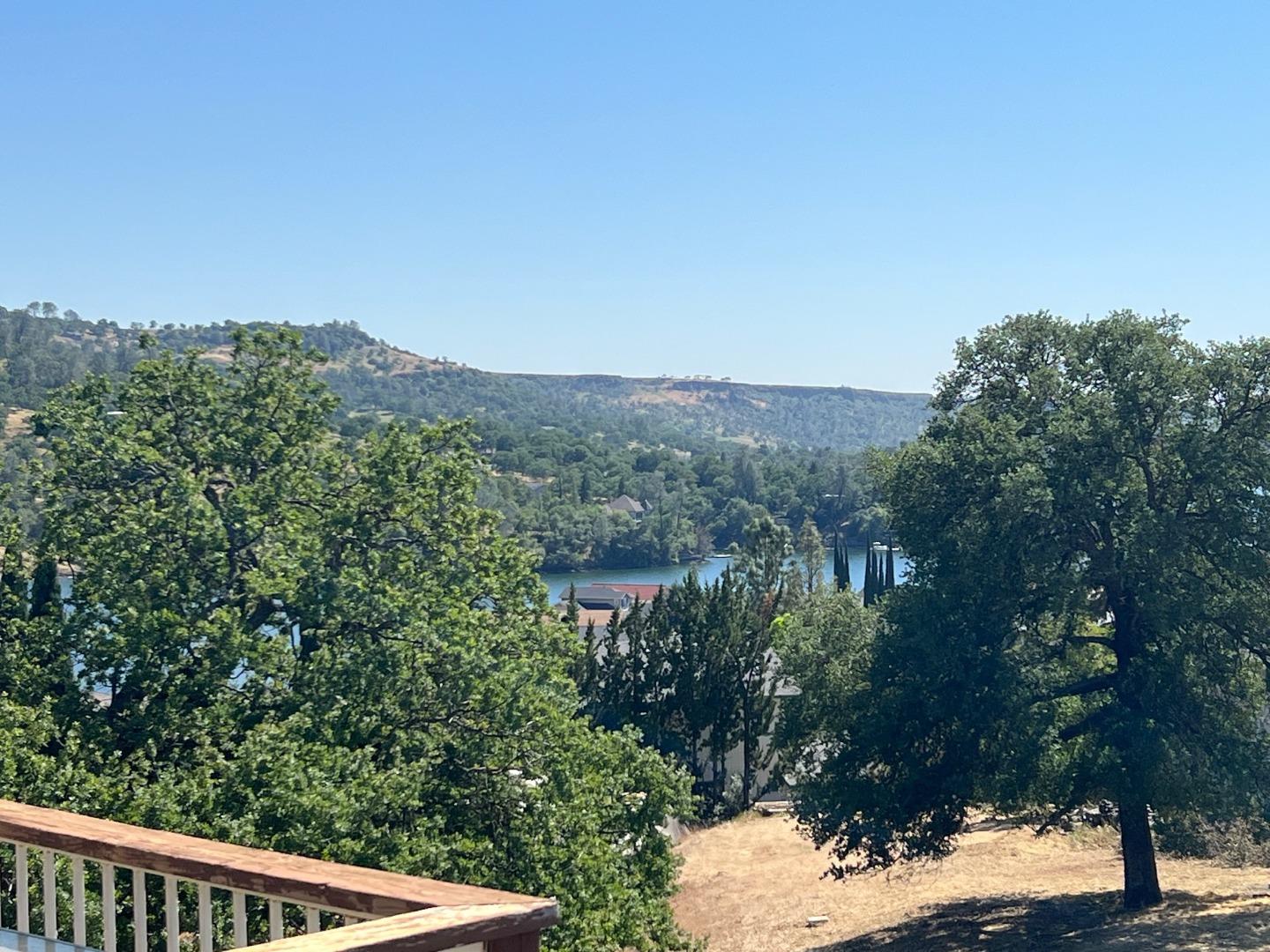 629 Poker Flat Road Copperopolis, CA 95228 - Photo 17 of 18 a view of a city with lush green forest
