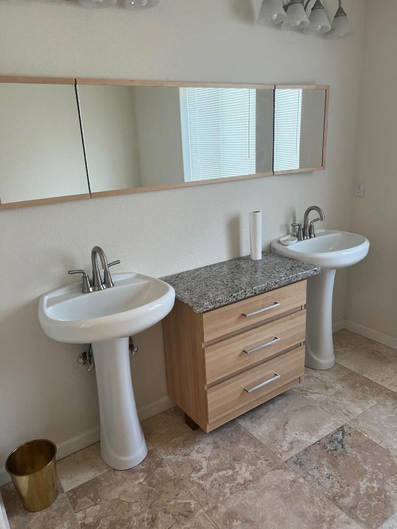 629 Poker Flat Road Copperopolis, CA 95228 - Photo 10 of 18 a bathroom with a sink and a mirror