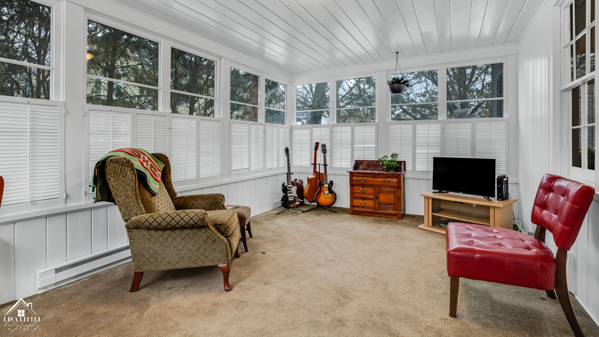 32W186 Army Trail Road Wayne, IL 60184 - Photo 14 of 27 a living room with furniture and a flat screen tv