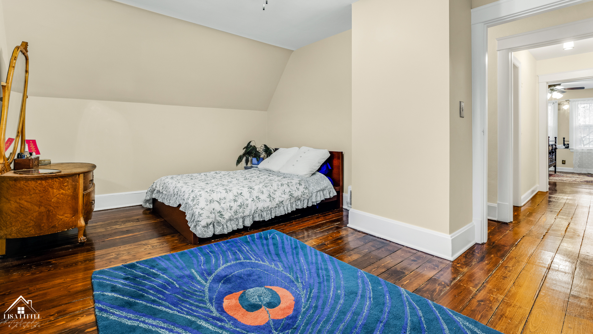 32W186 Army Trail Road Wayne, IL 60184 - Photo 21 of 27 a bedroom with a bed and wooden floor