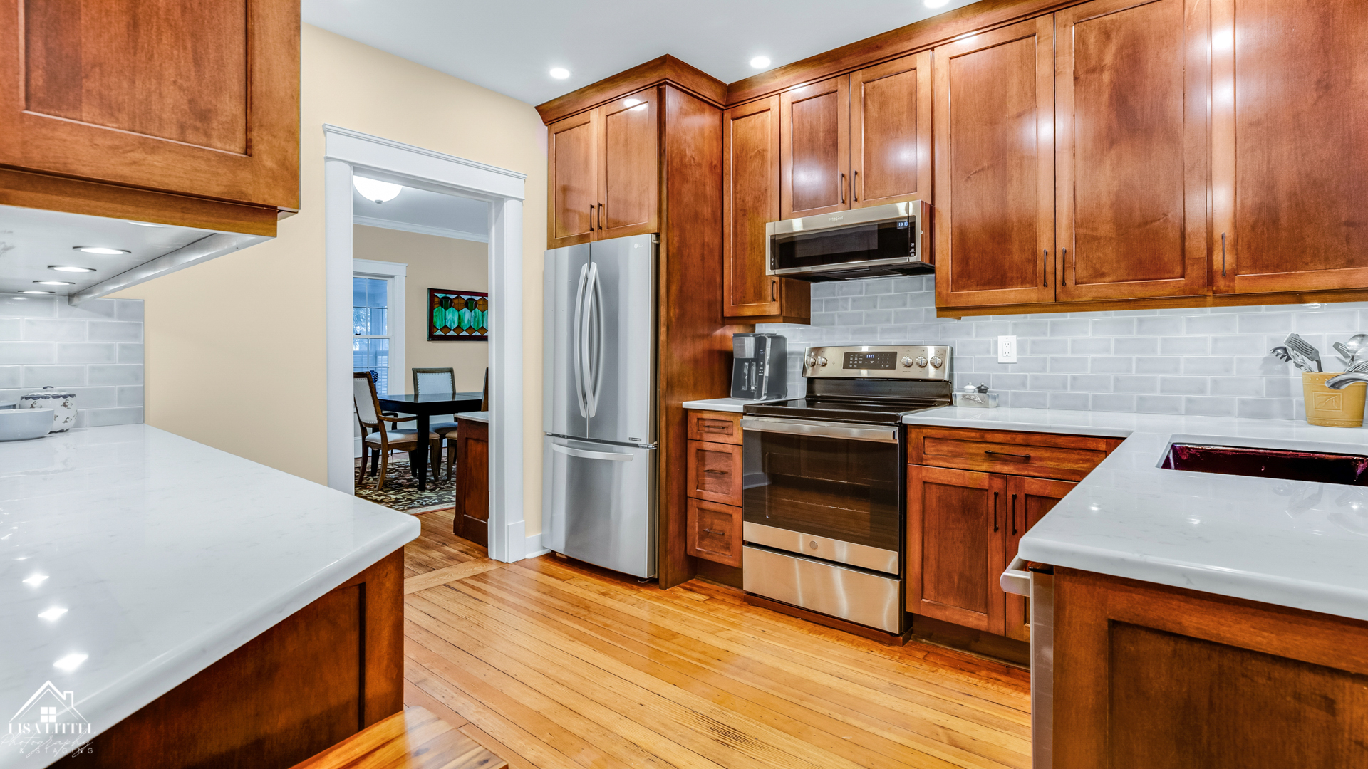 32W186 Army Trail Road Wayne, IL 60184 - Photo 9 of 27 a kitchen with stainless steel appliances a stove a refrigerator and cabinets