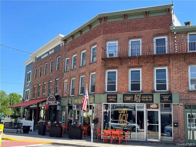 a front view of a building with street view